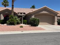 Charming single-story home featuring a well-manicured front yard, desert landscaping, and a two-car garage at 3028 Ripon Dr, Las Vegas, NV 89134