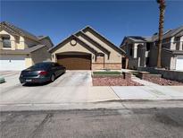 Charming single-story home featuring a well-manicured yard and a spacious two-car garage at 3078 Kennewick Dr, Las Vegas, NV 89121