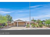 Charming single-story home with well-maintained front yard and covered parking at 3101 Greenbriar Dr, Las Vegas, NV 89121