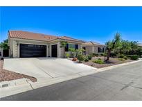 Charming home featuring a spacious driveway and a well-manicured front yard landscape at 5913 Audria Falls Ave, Las Vegas, NV 89131