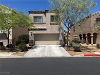 Charming two-story home with a well-maintained front yard and attached two-car garage at 6867 Dragonfly Rock St, Las Vegas, NV 89148