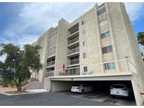 Multi-story condo complex featuring balconies and covered parking at 745 N Royal Crest Cir # 157, Las Vegas, NV 89169