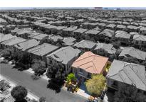 Stunning aerial view of a desert community, featuring a home with a terracotta roof at 11901 Luna Del Mar Ln, Las Vegas, NV 89138