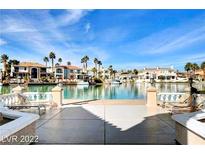 Beautiful back patio with water view, lounge chairs and patio furniture at 3111 Lido Isle Ct, Las Vegas, NV 89117