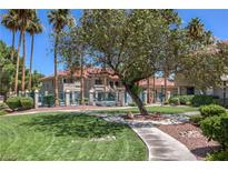 Beautifully landscaped apartment complex with mature trees and well-manicured lawns at 370 Manti Pl # 21, Henderson, NV 89014