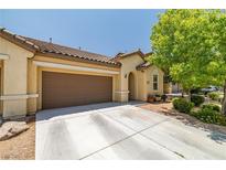 Charming single-story home featuring a well-maintained lawn and a two-car garage on a sunny day at 3773 Blake Canyon Dr, North Las Vegas, NV 89032