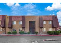 Charming two-story condo featuring unique architectural details and well-maintained landscaping at 5200 Indian River Dr # 301, Las Vegas, NV 89103