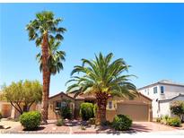 Inviting single-story home with mature palm trees and well-maintained desert landscaping in a desirable neighborhood at 5929 Gentle Creek Ln, North Las Vegas, NV 89031