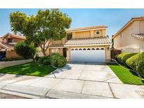 Charming two-story home featuring a well-maintained lawn and a spacious two-car garage at 8225 Bermuda Beach Dr, Las Vegas, NV 89128