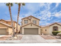 Charming two-story home featuring a two-car garage and desert landscaping at 9129 Patrick Henry Ave, Las Vegas, NV 89149