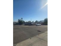 A wide angle street view showcases the property's neighborhood with blue sky background at , Las Vegas, NV 89104