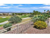 A backyard showcasing a beautifully landscaped yard and a view of a golf course at 10700 Button Willow Dr, Las Vegas, NV 89134
