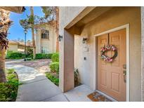 Inviting entryway with a charming front door and a beautiful floral wreath, creating a warm welcome at 2050 W Warm Springs Rd # 4512, Henderson, NV 89014