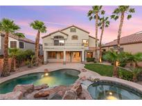 Beautiful backyard featuring a pool, spa, patio, landscaping, and palm trees with a view of the home at 2221 Grier Woods Ct, Las Vegas, NV 89134