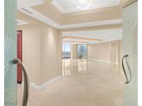 Bright, open living room with marble floors and city views at 2747 Paradise Rd # 2704, Las Vegas, NV 89109