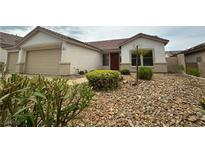 Charming single-story home featuring a xeriscaped front yard and a two-car garage at 33 Hatten Bay St, Henderson, NV 89012