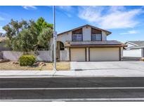 Two-story home featuring a two-car garage and solar panels at 3746 E Harmon Ave, Las Vegas, NV 89121