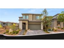 Beautiful two-story home with manicured landscaping and a two-car garage at 389 Red Feather Peak Ct, Las Vegas, NV 89138