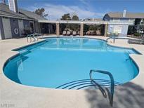 Beautiful community pool with a pergola, lounge chairs and shallow end at 5420 Centurion Ct # 104, Las Vegas, NV 89122