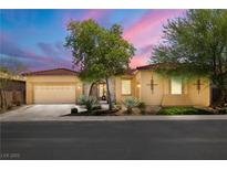 Charming single-story home featuring a well-manicured front yard and neutral stucco exterior in a gated community at 7914 Elk Mountain St, Las Vegas, NV 89113