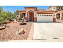 Charming single-story home featuring desert landscaping and a cozy front water fountain at 7929 Palace Monaco Ave, Las Vegas, NV 89117