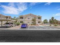 Attractive two-story building featuring a balcony and convenient parking spaces at 1881 W Alexander Rd # 2093, North Las Vegas, NV 89032