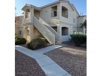 Multi-story building showcasing architectural details and well-maintained landscaping at 1881 W Alexander Rd # 2093, North Las Vegas, NV 89032