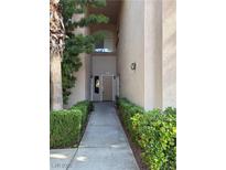 Inviting walkway leading to the front door with manicured landscaping at 2050 W Warm Springs Rd # 4021, Henderson, NV 89014