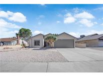 Charming single-story home with desert landscaping and a two-car garage at 3115 Floral Vista Ave, Henderson, NV 89014