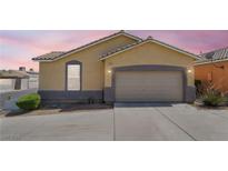 Charming single-story home with a two-car garage and well-maintained landscaping at 5031 Droubay Dr, Las Vegas, NV 89122