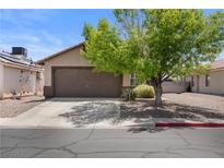 Charming single-story home features a two-car garage and well-maintained landscaping at 5550 Ramirez St, North Las Vegas, NV 89031