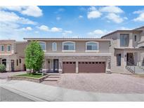 Beautiful two-story home featuring a three-car garage and well-maintained front yard at 5788 Robin Ridge Ave, Las Vegas, NV 89141