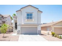 Inviting two-story home with a well-maintained front yard and a convenient two-car garage at 7021 Salt Marsh Ct, Las Vegas, NV 89148
