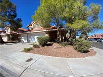 Charming two-story home with a two-car garage and desert landscaping in a quiet neighborhood at 7604 Cruz Bay Ct, Las Vegas, NV 89128