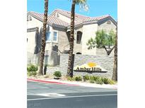 Exterior view of the Amber Hills condos, highlighting the building's architecture and well-maintained landscaping at 9470 Peace Way # 212, Las Vegas, NV 89147