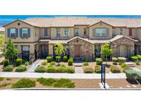 Charming townhome with stone accents, lush landscaping, and a welcoming entrance at , Henderson, NV 89044