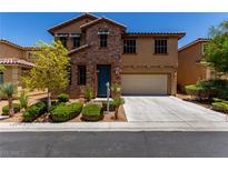 Charming two-story home featuring a stone facade, well-manicured landscaping, and an attached two-car garage at 10584 Peach Creek St, Las Vegas, NV 89179