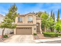 Charming two-story home featuring a well-manicured front yard and a two-car garage at 1844 Winners Cup Drive, Las Vegas, NV 89117