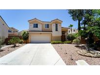 Charming two-story home featuring a spacious driveway and a well-manicured yard in a desirable neighborhood at 2017 Shining Feather Ln, Las Vegas, NV 89134