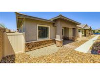 Charming single-story home featuring tasteful brick accents and inviting front entryway at 209 Bennett Pointe Ave, Henderson, NV 89011