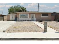 Charming single-story home with gravel front yard and sidewalk leading to the entrance at 2616 Spear St, North Las Vegas, NV 89030