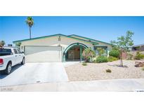 Charming single-story home featuring a two-car garage and well-maintained front yard with desert landscaping at 3484 Anthony Dr, Las Vegas, NV 89121