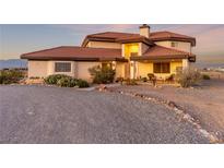 Stunning single-story home with desert landscaping and red tile roof at 3821 Tumbleweed Ave, Pahrump, NV 89048