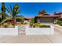 Charming single-story home featuring well-maintained landscaping, driveway, and a red tiled roof at 3826 Edmond St, Las Vegas, NV 89103