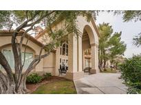 Inviting entrance with large archway, seating, and well-maintained landscaping at 5415 W Harmon Ave # 1162, Las Vegas, NV 89103