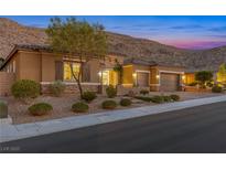 Charming single-story home featuring a tile roof, landscaped front yard, and a convenient three-car garage at 6315 Carol Butte Ct, Las Vegas, NV 89141