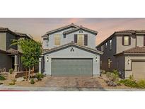 Charming two-story home featuring a well-maintained front yard and a two-car garage at 6964 Caldera St, Las Vegas, NV 89149