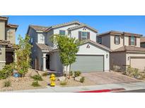 Charming two-story home featuring a neutral exterior, well-kept landscaping, and a two-car garage at 6964 Caldera St, Las Vegas, NV 89149