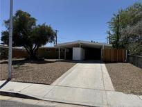Charming single-story home featuring a covered carport, minimalist landscaping, and a well-maintained front yard at 709 N 22Nd St, Las Vegas, NV 89101