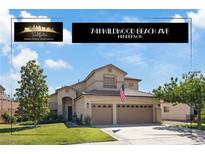 Charming two-story home featuring a three-car garage and well-maintained landscaping at 741 Wildwood Beach Ave, Henderson, NV 89052